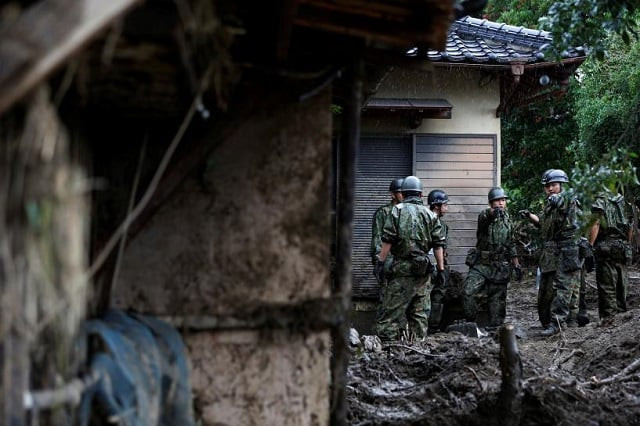 japanese self defense force soldiers conduct search and rescue operation at a damaged house caused by a heavy rain in asakura fukuoka prefecture japan july 9 2017 photo reuters japanese self defense force soldiers conduct search and rescue operation at a damaged house caused by a heavy rain in asakura fukuoka prefecture japan july 9 2017 photo reuters