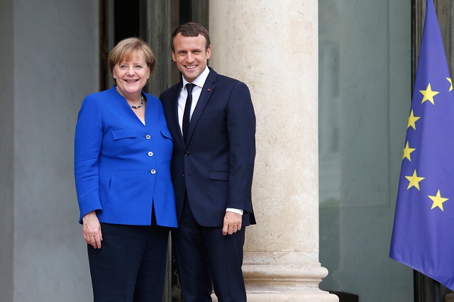 german chancellor angela merkel l and french president emmanuel macron pose at the elysee palace in paris on july 13 2017 ahead of an annual franco german summit photo afp