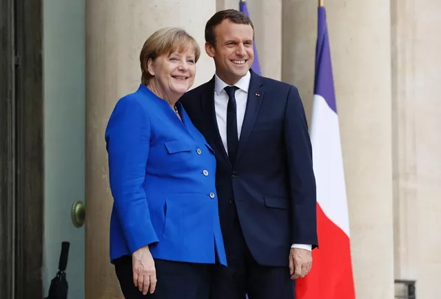 german chancellor angela merkel l poses beside french president emmanuel macron during an annual franco german summit at the elysee palace in paris on july 13 2017 photo afp german chancellor angela merkel l poses beside french president emmanuel macron during an annual franco german summit at the elysee palace in paris on july 13 2017 photo afp