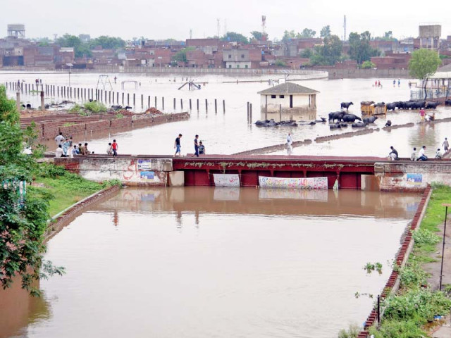 an underpass submerged in rainwater in gujranwala photo express an underpass submerged in rainwater in gujranwala photo express
