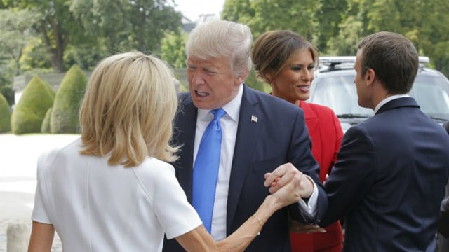 french president emmanuel macron r welcomes us first lady melania trump 2nd r while his wife brigitte macron l welcomes us president donald trump 2nd l in paris on july 13 2017 photo afp french president emmanuel macron r welcomes us first lady melania trump 2nd r while his wife brigitte macron l welcomes us president donald trump 2nd l in paris on july 13 2017 photo afp