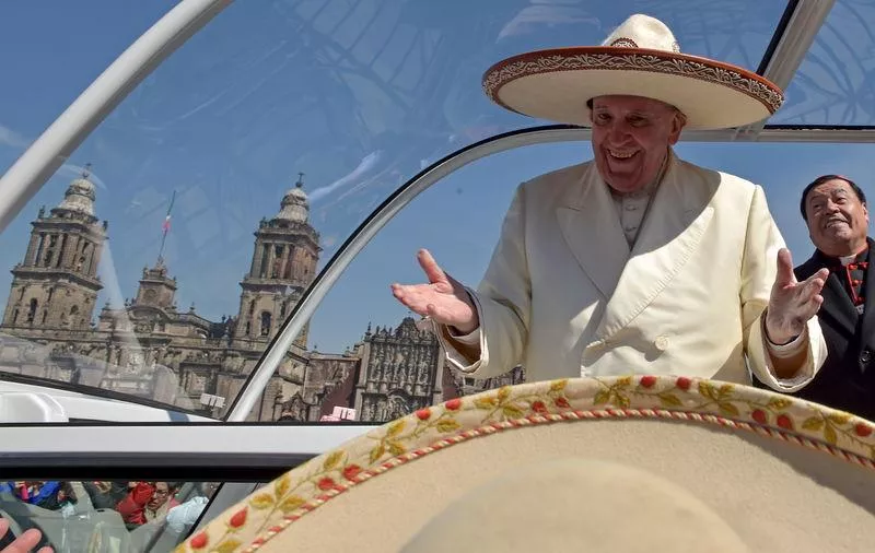 pope francis gestures while wearing a mariachi hat given to him by someone in the crowd on zocalo square in mexico city photo reuters pope francis gestures while wearing a mariachi hat given to him by someone in the crowd on zocalo square in mexico city photo reuters