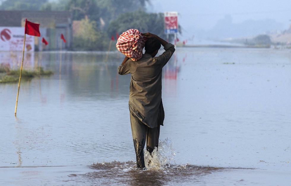 villages fields surrounding the embankment flooded with water photo afp