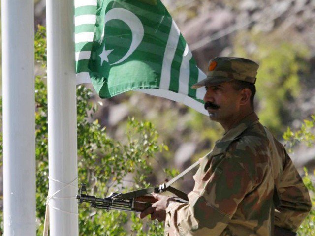 a pakistani soldier stands guard along the loc photo express file