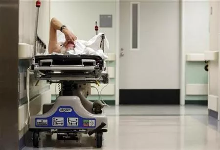a patient waits in the hallway of a hospital photo reuters a patient waits in the hallway of a hospital photo reuters