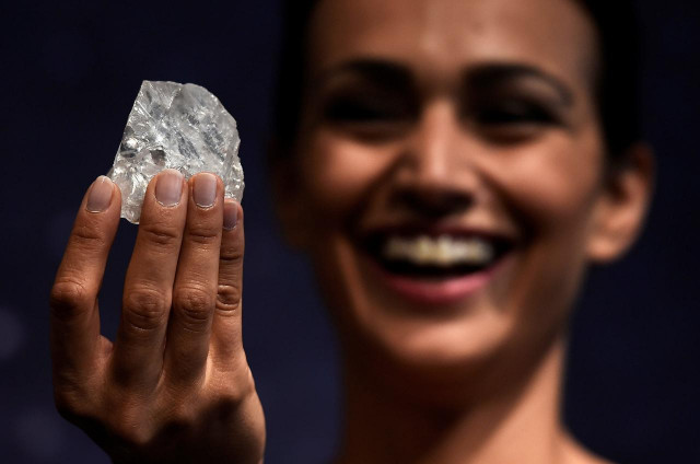 a model shows off the 1109 carat quot lesedi la rona quot the largest gem quality rough diamond discovered in over 100 years during a sale preview at sotheby 039 s auction house in london britain photo reuters