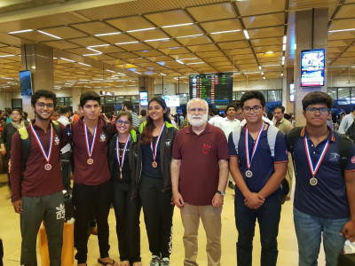 triumphant rowing teens return home