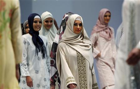 models present creations for muslim women during an islamic fashion fair in istanbul photo reuters