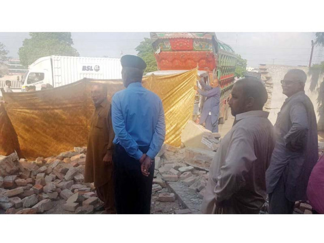 police officials stand at the site where a truck rammed into khanna police station killing two people photo express police officials stand at the site where a truck rammed into khanna police station killing two people photo express