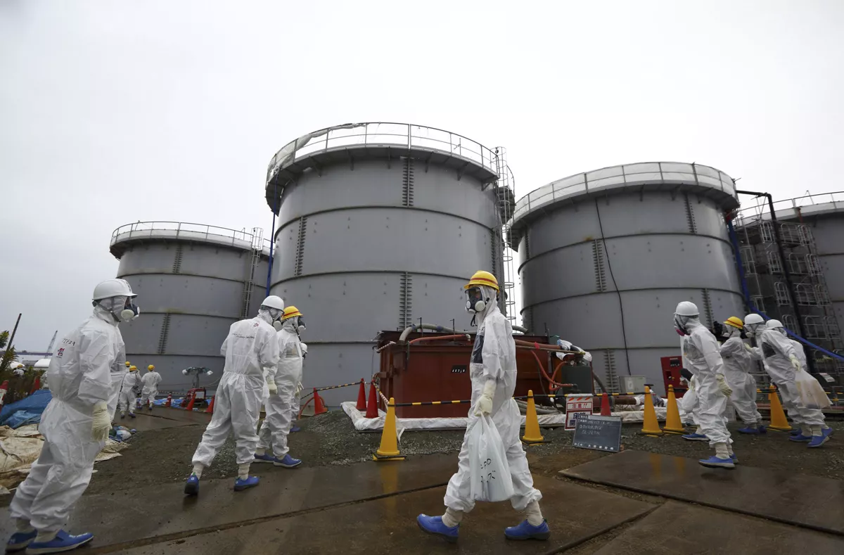 members of the media and tokyo electric power co employees wearing protective suits and masks walk past storage tanks for radioactive water in the h4 area at the tsunami crippled tepco fukushima daiichi nuclear power plant in fukushima prefecture in this file picture taken november 7 2013 photo reuters members of the media and tokyo electric power co employees wearing protective suits and masks walk past storage tanks for radioactive water in the h4 area at the tsunami crippled tepco fukushima daiichi nuclear power plant in fukushima prefecture in this file picture taken november 7 2013 photo reuters