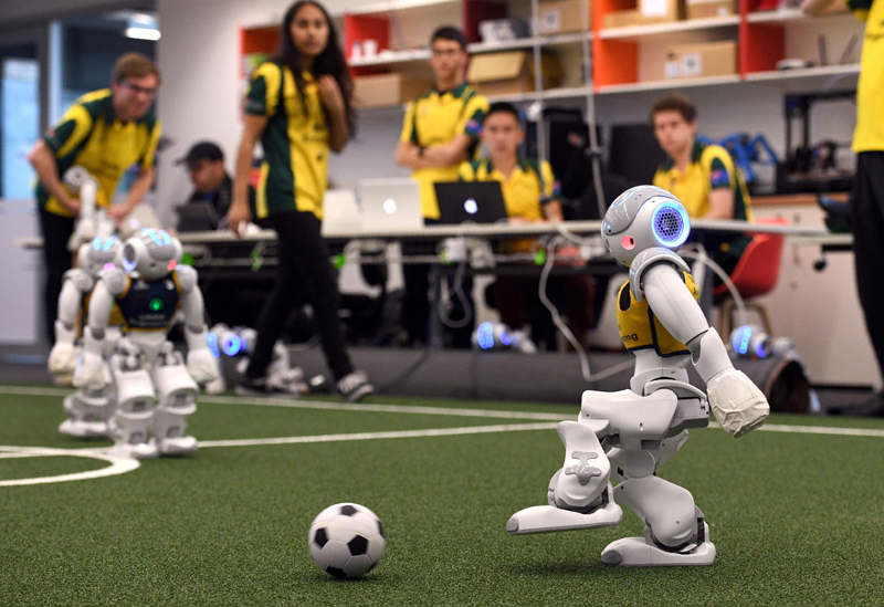 robots battle it out for the soccer ball in sydney on july 21 2017 as australia s five time world champions of robot soccer the university of new south wales 039 unsw runswift team heads to japan this weekend to try and recapture the international trophy for a record sixth time facing off against powerful teams from germany and the usa photo afp