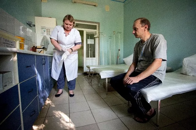 a patient waits in a hospital treating drug users in the rebel capital of donetsk ukraine photo afp a patient waits in a hospital treating drug users in the rebel capital of donetsk ukraine photo afp