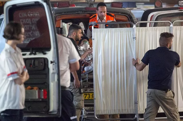 medics evacuate an israeli woman who was injured during a knife attack in the jewish settlement of neve tsuf at the west bank at a hospital in jerusalem july 21 2017 photo reuters medics evacuate an israeli woman who was injured during a knife attack in the jewish settlement of neve tsuf at the west bank at a hospital in jerusalem july 21 2017 photo reuters
