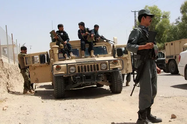 afghan security personnel sit on atop an armoured vehicles amid an ongoing battle with taliban militants in the gereshk district of helmand province on july 22 2017 a us airstrike has killed 16 policemen in afghanistan officials said july 22 the latest setback to washington 039 s efforts to bring peace to the war torn country the incident took place in helmand province on friday as afghan security forces attempted to clear a village of taliban militants salam afghan a police spokesman told afp photo afp