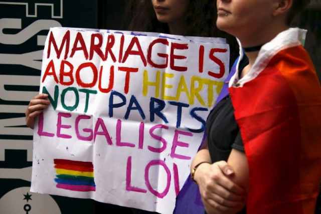 a gay rights activist holds a placard during a rally supporting same sex marriage in sydney australia photo reuters a gay rights activist holds a placard during a rally supporting same sex marriage in sydney australia photo reuters