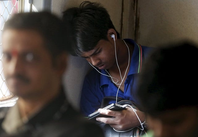 a man watches a video on his mobile phone as he commutes by a suburban train in mumbai india march 31 2016 photo reuters file a man watches a video on his mobile phone as he commutes by a suburban train in mumbai india march 31 2016 photo reuters file