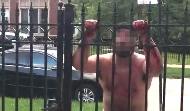 the footage begins by showing the man who is bleeding heavily from his crotch shouting nonsense and swearing at residents who are behind a large metal gate photo courtesy mailonline the footage begins by showing the man who is bleeding heavily from his crotch shouting nonsense and swearing at residents who are behind a large metal gate photo courtesy mailonline