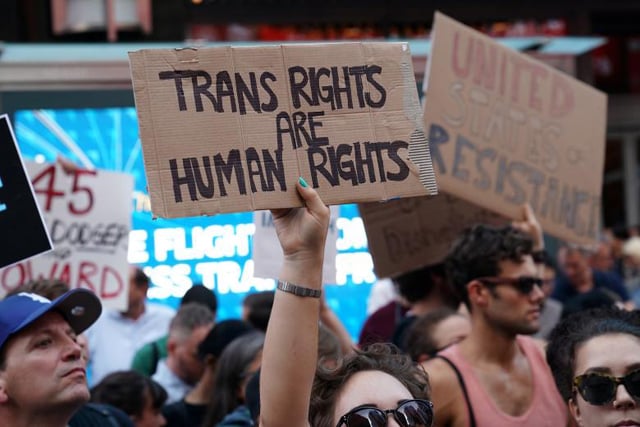 people protest president donald trump 039 s announcement that he plans to reinstate a ban on transgender individuals from serving in any capacity in the us military in times square in new york city new york photo reuters