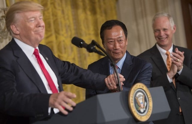 us president donald trump shakes hands with terry gou c chairman of foxconn an electronics supplier during an announcement that the company will open a manufacturing facility in wisconsin photo afp us president donald trump shakes hands with terry gou c chairman of foxconn an electronics supplier during an announcement that the company will open a manufacturing facility in wisconsin photo afp