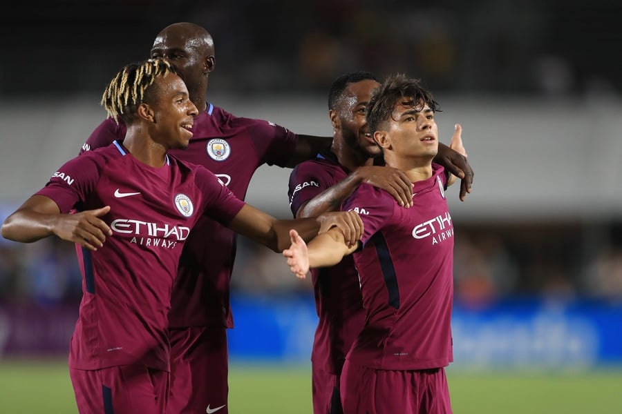 demeaco duhaney eliaquim mangala and raheem sterling congratulate brahim diaz after he scored a goal during the second half of the international champions cup soccer match at los angeles memorial coliseum on july 26 2017 in los angeles california photo afp