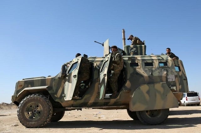 syrian democratic forces sdf stand on their military vehicle in northern deir al zor province ahead of an offensive against islamic state militants syria february 21 2017 photo reuters