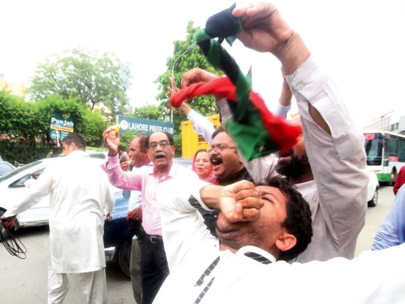 a man celebrates the panamagate verdict outside the lahore press club photo abid nawaz express a man celebrates the panamagate verdict outside the lahore press club photo abid nawaz express