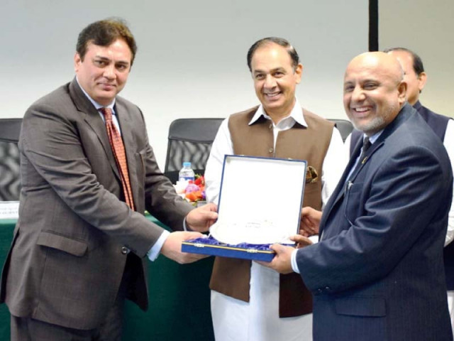 nab chairman qamar zaman chaudhry receives a shield at nbp training academy photo express nab chairman qamar zaman chaudhry receives a shield at nbp training academy photo express