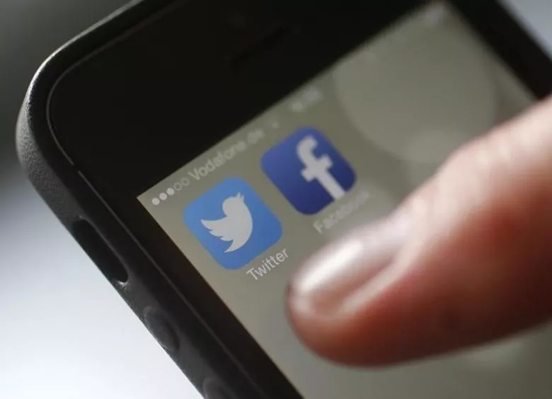 an illustration picture shows a man starting his twitter app on a mobile device photo reuters an illustration picture shows a man starting his twitter app on a mobile device photo reuters