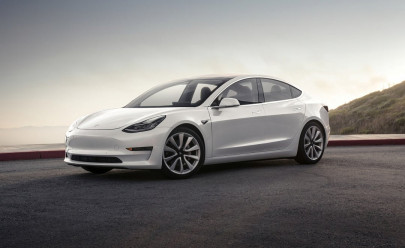 tesla s musk hands over first model 3 electric cars to early buyers tesla s musk hands over first model 3 electric cars to early buyers