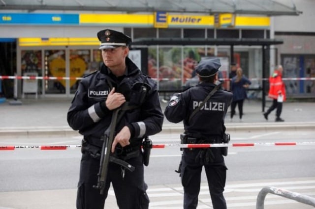 police cordon off the area around a supermarket in the northern german city of hamburg where a man killed one person and wounded several others in a knife attack on july 28 2017 there is no valid information yet on the motive or the number of people injured by the man who entered a supermarket and suddenly began attacking customers said police adding that one victim died from his severe wounds photo afp