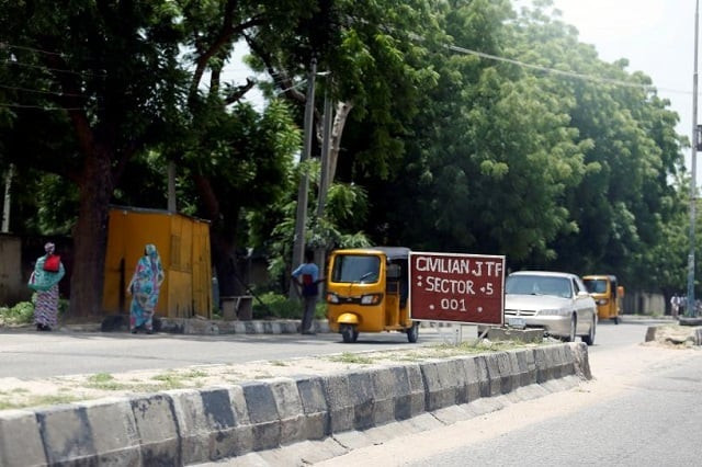 a car drives towards a civilian joint task force cjtf sector 5 sign in maiduguri nigeria august 30 2016 photo reuters a car drives towards a civilian joint task force cjtf sector 5 sign in maiduguri nigeria august 30 2016 photo reuters