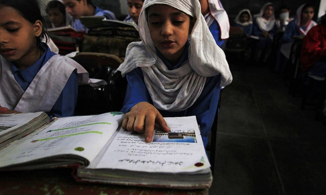 a girl reading in a school somewhere in balochistan photo reuters a girl reading in a school somewhere in balochistan photo reuters