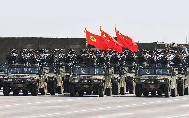 4 chinese soldiers carry the flags of l to r the communist party the state and the people 039 s liberation army during a military parade at the zhurihe training base in china 039 s northern inner mongolia region photo afp 4 chinese soldiers carry the flags of l to r the communist party the state and the people 039 s liberation army during a military parade at the zhurihe training base in china 039 s northern inner mongolia region photo afp