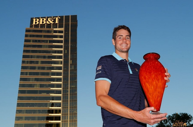 john isner poses with the trophy after winning the bb amp t atlanta open at atlantic station on july 30 2017 in atlanta photo afp john isner poses with the trophy after winning the bb amp t atlanta open at atlantic station on july 30 2017 in atlanta photo afp