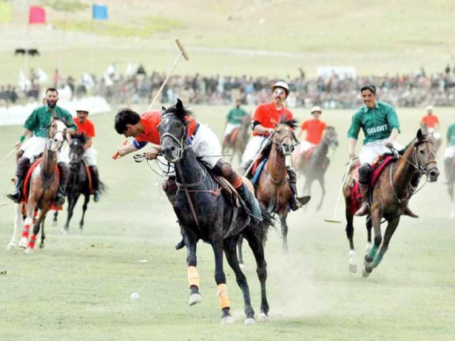 a polo player attempts to strike the ball with his mallet in the famous shandur polo festival in chitral photo express a polo player attempts to strike the ball with his mallet in the famous shandur polo festival in chitral photo express