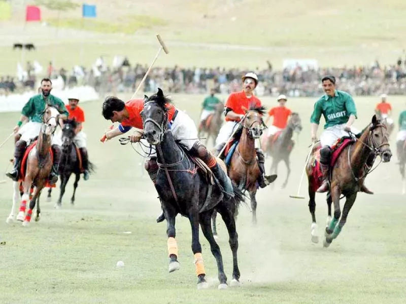 a polo player attempts to strike the ball with his mallet in the famous shandur polo festival in chitral photo express a polo player attempts to strike the ball with his mallet in the famous shandur polo festival in chitral photo express