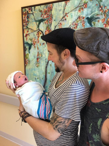 trystan reese and bill chaplow head home with their baby boy photo reuters