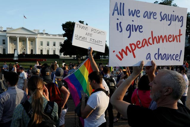 demonstrators gather to protest president donald trump 039 s announcement that he plans to reinstate a ban on transgender individuals from serving in any capacity in the u s military at the white house in washington photo reuters demonstrators gather to protest president donald trump 039 s announcement that he plans to reinstate a ban on transgender individuals from serving in any capacity in the u s military at the white house in washington photo reuters