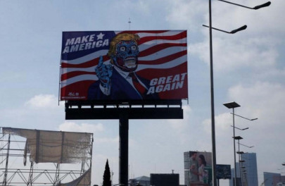 alien trump descends on mexico in artist s billboard