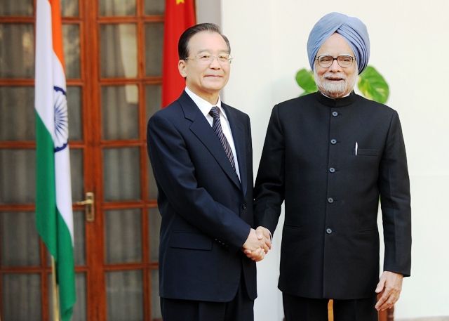 chinese prime minister wen jiabao l shakes hands with india prime minister manmohan singh r prior to a meeting in new delhi on december 16 2010 photo afp