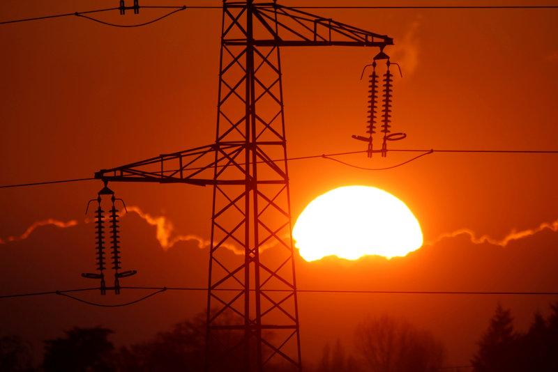 electrical power pylons of high tension electricity power lines are seen at sunset photo reuters