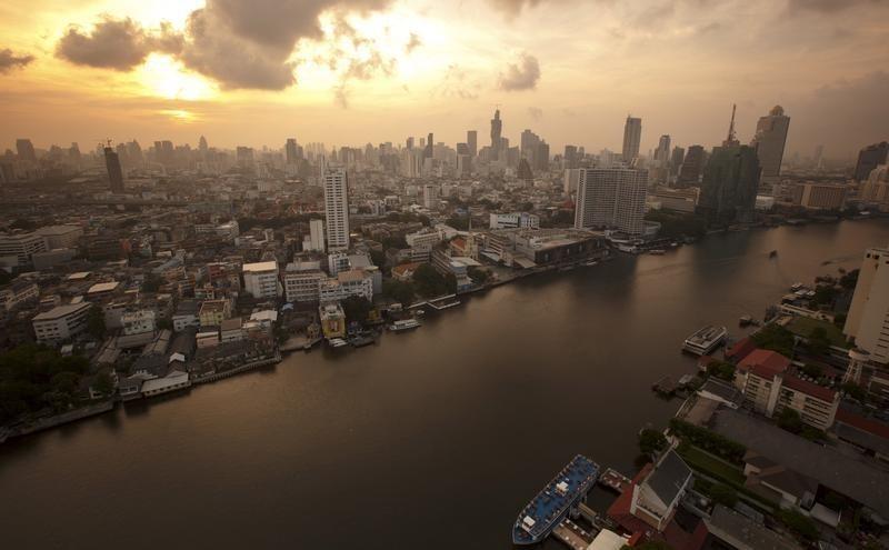 the skyline of central bangkok and the chao phraya river are seen during sunrise in bangkok photo reuters