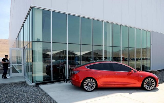 a prototype of the tesla model 3 is on display in front of the factory during a media tour of the tesla gigafactory which will produce batteries for the electric carmaker in sparks nevada u s july 26 2016 photo reuters