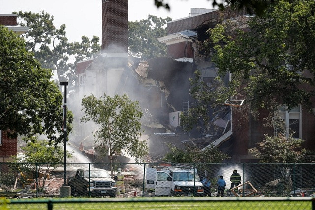 the blast pushed part of the building 039 s wall outwards causing the roof to collapse and pancaking two floors into rubble according to fire chief john fruetel photo reuters