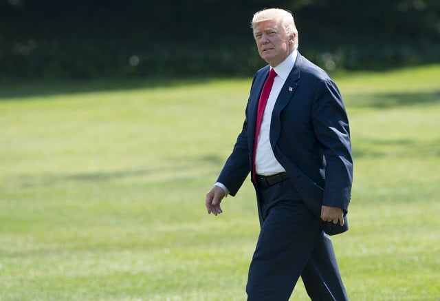 us president donald trump walks to marine one prior to departure from the south lawn of the white house in washington dc august 4 2017 as he travels on a 17 day vacation to trump 039 s golf course in bedminster new jersey photo afp