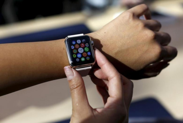 a customer looks over an apple watch in palo alto california april 10 2015 photo reuters a customer looks over an apple watch in palo alto california april 10 2015 photo reuters