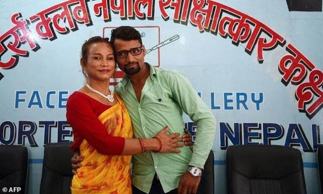 nepali transgender woman monika shahi nath l pose for a picture with her husband ramesh nath r after announcing the registration of their marriage at a press conference in kathmandu on august 5 2017 photo afp