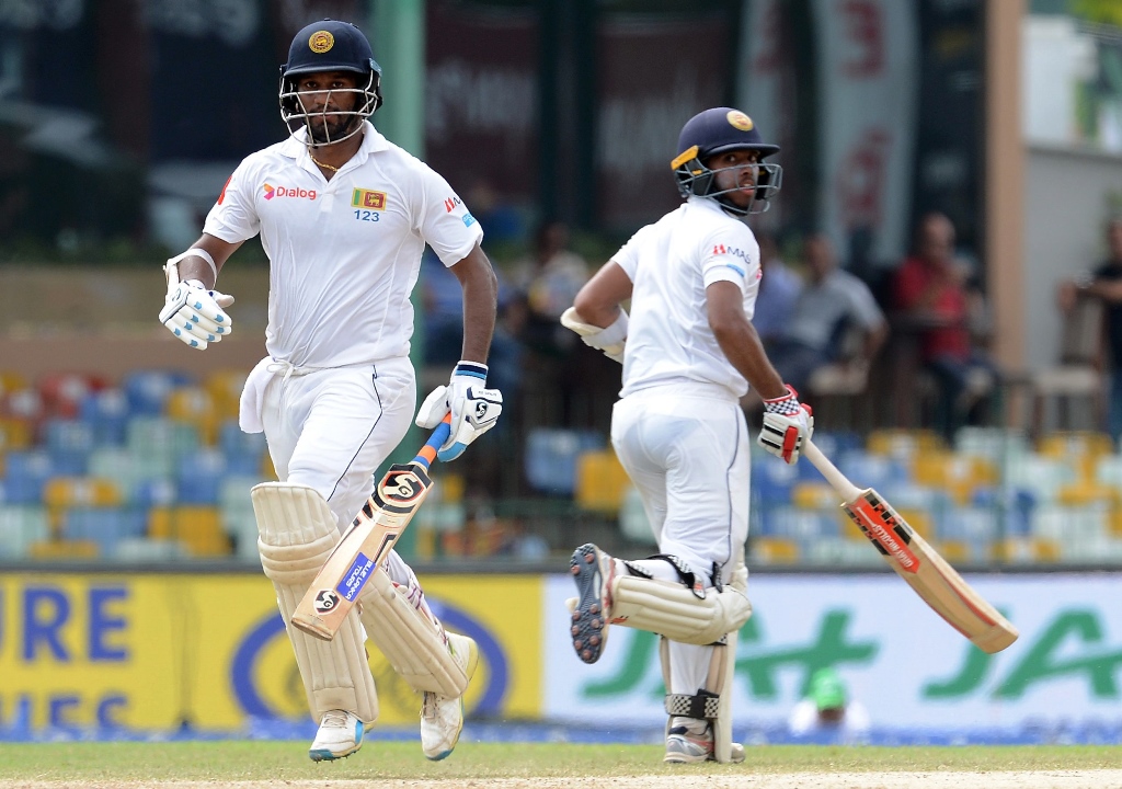 fight for survival sri lanka s kusal mendis and dimuth karunaratne pulled off a crucial partnership to keep their team s hopes alive of a remarkable comeback as stumps were called on third day photo afp