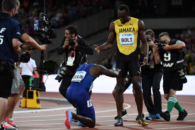 us athlete justin gatlin l bends down to jamaica 039 s usain bolt after the final of the men 039 s 100m athletics event at the 2017 iaaf world championships at the london stadium in london on august 5 2017 photo afp us athlete justin gatlin l bends down to jamaica 039 s usain bolt after the final of the men 039 s 100m athletics event at the 2017 iaaf world championships at the london stadium in london on august 5 2017 photo afp
