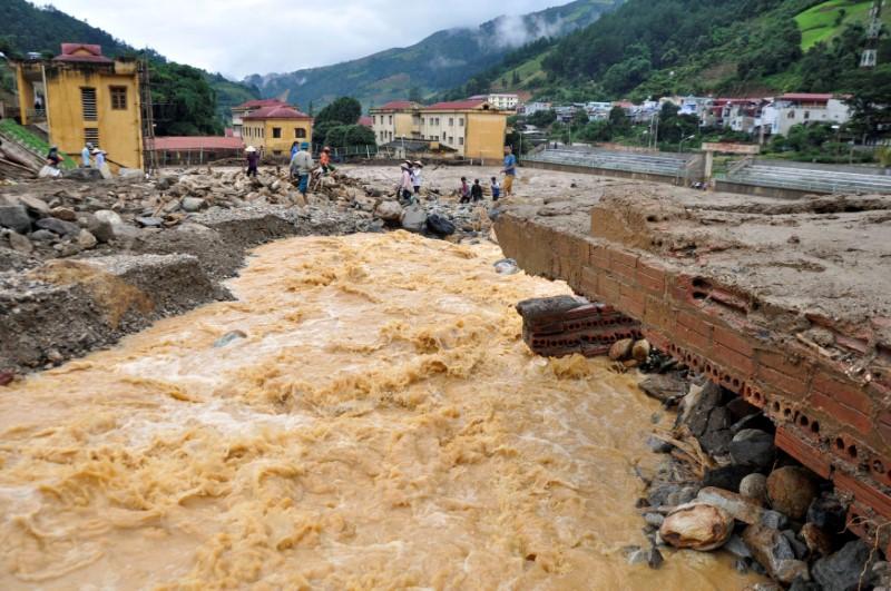 a bridge damaged by floods is seen in mu cang chai district in northern yen bai province vietnam august 4 2017 picture taken on august 4 2017 photo reuters